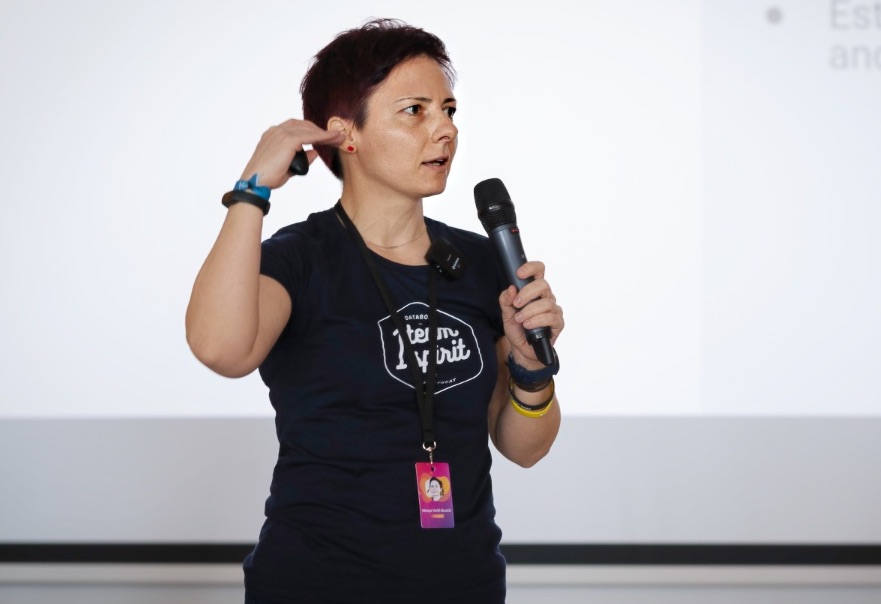 Mateja speaking at conference